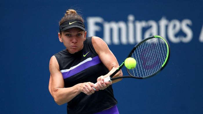 Simona Halep lewati babak pertama AS Terbuka, menyetop tren buruknya di kejuaraan ini. (Foto: Clive Brunskill/Getty Images)