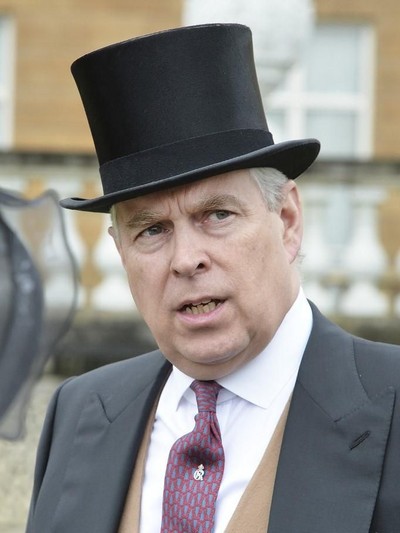 (FILES) In this file photo taken on May 10, 2016 Britains Prince Andrew, Duke of York (C) speaks to guests in the garden of Buckingham Palace in London as up to 8,000 guests attend the first royal garden party of the year on May 10, 2016. - Britains Prince Andrew has said on August 18, 2019 he was 