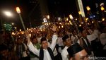 Aksi Ribuan Peserta Pawai Obor Long March dari Monas ke Bundaran HI