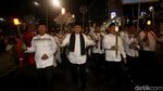 Aksi Ribuan Peserta Pawai Obor Long March dari Monas ke Bundaran HI