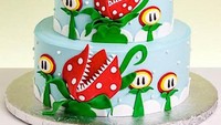 Lucunya kue pengantin ini bertema Mario Bross. Masing-masing tingkatan pun dibuat detail seperti yang ada di video game sungguhan. Foto: Istimewa