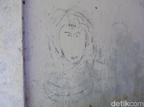 Coretan dinding di Kampung 'HIlang' di Banyuwangi/