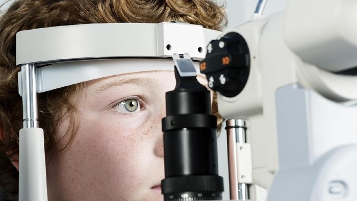 Young boy, 10 years old, having his eyesight checked.