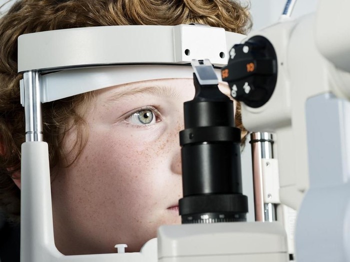 Young boy, 10 years old, having his eyesight checked.