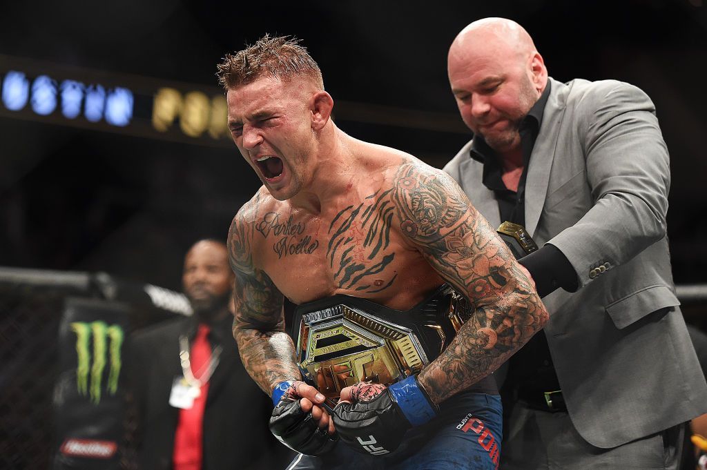 ATLANTA, GEORGIA - APRIL 13: Dustin Poirier celebrates after recieving the title belt from UFC President Dana White during the UFC 236 event at State Farm Arena on April 13, 2019 in Atlanta, Georgia. (Photo by Logan Riely/Getty Images)