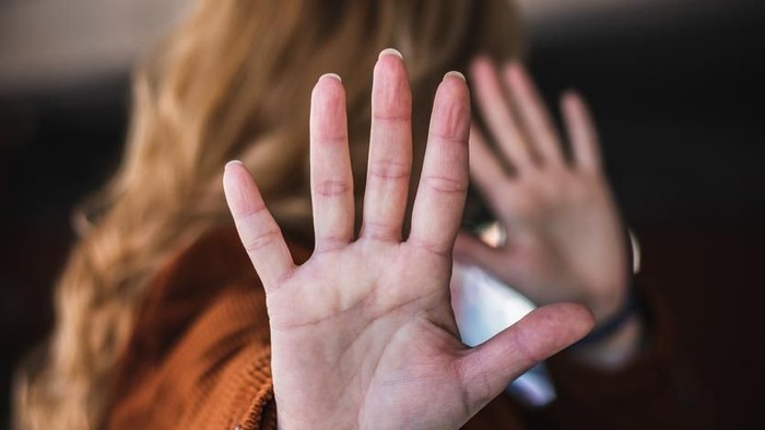 Pelecehan Seksual Perempuan woman raised her hand for dissuade, campaign stop violence against women. Asian woman raised her hand for dissuade with copy space, black and white color