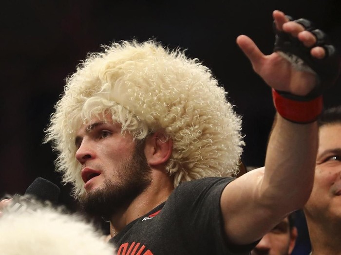 Russian UFC fighter Khabib Nurmagomedov, speaks after wining against UFC fighter Dustin Poirier, of Lafayette, La., during Lightweight title mixed martial arts bout at UFC 242, in Yas Mall in Abu Dhabi, United Arab Emirates, Saturday , Sept.7 2019. (AP Photo/ Mahmoud Khaled)