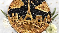 Pie ini dibentuk menjadi menara Eiffel bernuansa di malam hari, sehingga terlihat sangat cantik. Dilengkapi dengan bentuk beberapa bangunan di kota Paris. Namanya adalah Twilight in Paris Pie. Foto: Instagram @thepieous