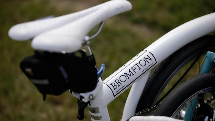 CHICHESTER, ENGLAND - JULY 28:  A bike wears the name Brompton at the Brompton World Championship folding bike race, which is part of the Orbital cycling festival at Goodwood Motor Circuit on July 28, 2013 in Chichester, England. The race starts with a Le-Mans style sprint to the riders bike, which is then assembled and followed by a 15.2km ride. A strict dress code of jacket and tie applies, with an award going to the most stylishly dressed.  (Photo by Matthew Lloyd/Getty Images)