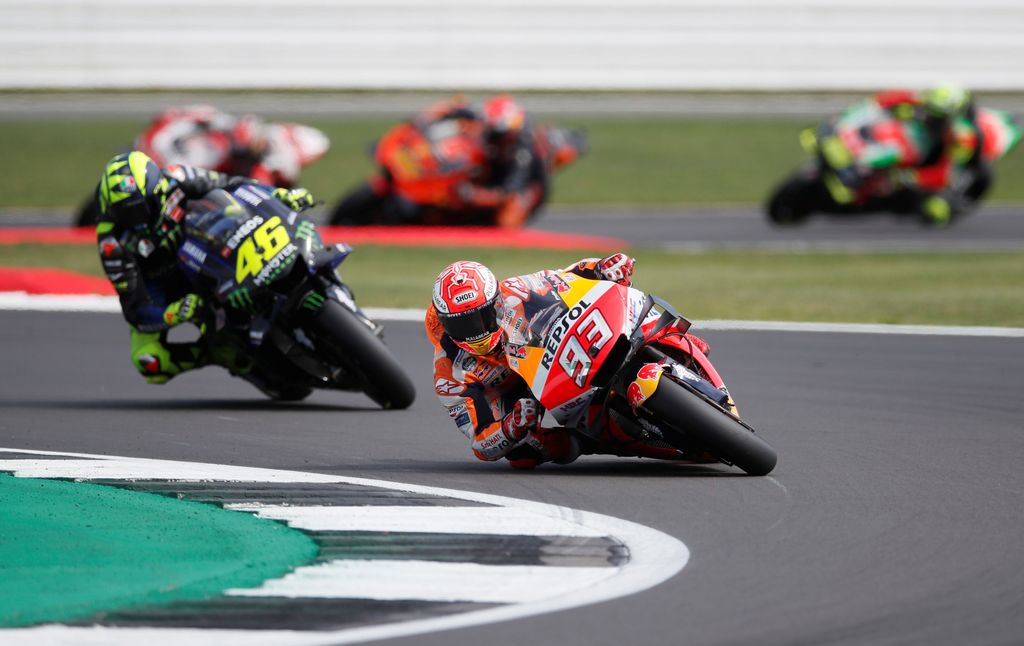 MotoGP - British Grand Prix - Silverstone Circuit, Silverstone, Britain - August 25, 2019  Repsol Honda's Marc Marquez and Monster Energy Yamaha's Valentino Rossi in action during the race  REUTERS/David Klein