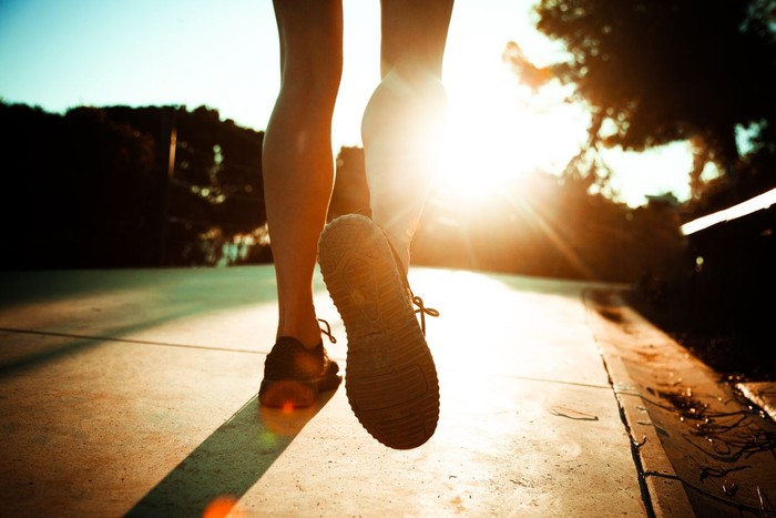 young fitness woman runner /hiker legs at forest trail