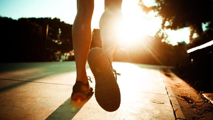 young fitness woman runner /hiker legs at forest trail