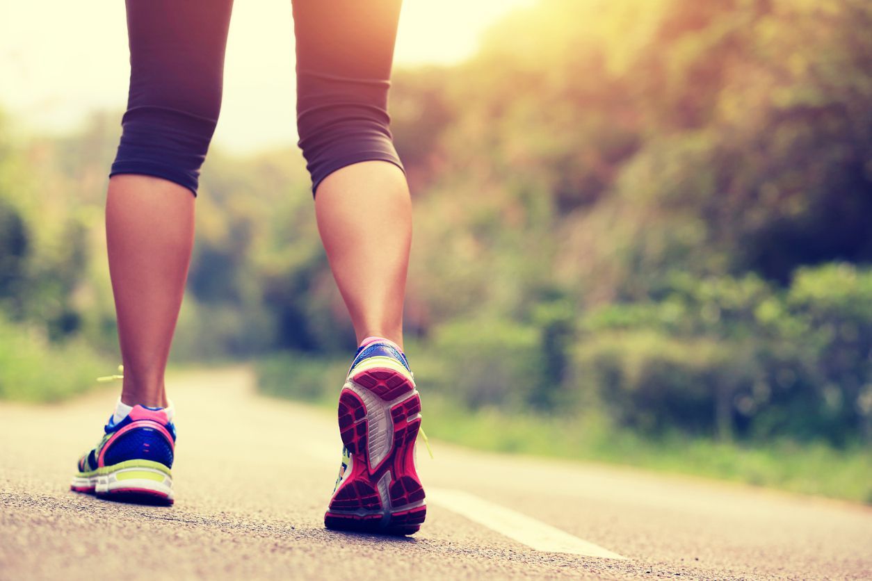 young fitness woman runner /hiker legs at forest trail