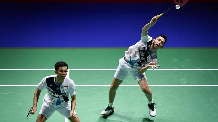 Fajar Alfian/Muhammad Rian Ardianto akan tampil di semifinal Korea Open 2019 (Foto: Fabrice Coffrini/AFP)