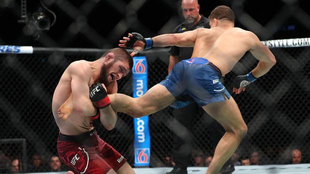 NEW YORK, NY - APRIL 07: Khabib Nurmagomedov (L) attempts a takedown on Al Iaquinta (R) during their UFC lightweight championship bout at UFC 223 at Barclays Center on April 7, 2018 in New York City.   Ed Mulholland/Getty Images/AFP