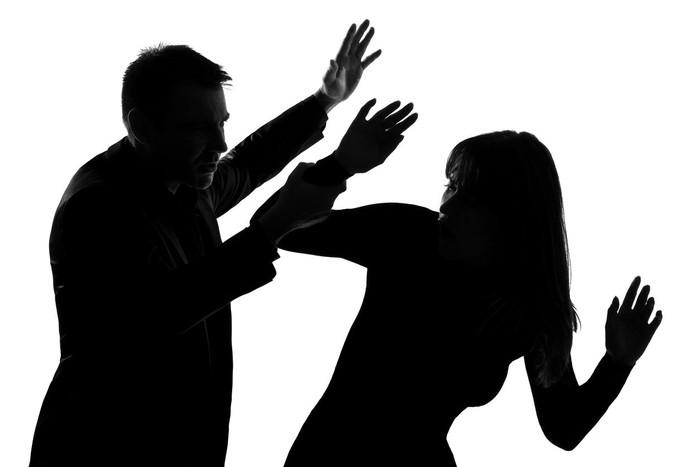 one caucasian couple man and woman expressing domestic violence in studio silhouette   on white background