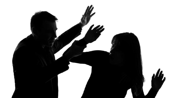 one caucasian couple man and woman expressing domestic violence in studio silhouette   on white background