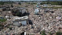 Sisa-sisa bangunan permukiman warga nampak terlihat pascagempa dan tsunami yang terjadi di Palu dan Donggala, Sulawesi Tengah, satu tahun lalu. Istimewa/UN OCHA Asia-Pacific via Reuters.