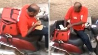 Kurir sebuah restoran ini tertangkap basah sedang menyantap makanan yang seharusnya ia kirim. Istimewa/Dok. Boredpanda.