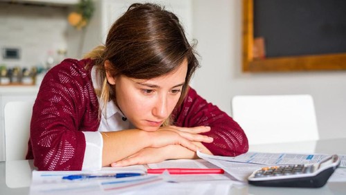 Couple is watching TV in the bed and the wife is unhappy with the channel