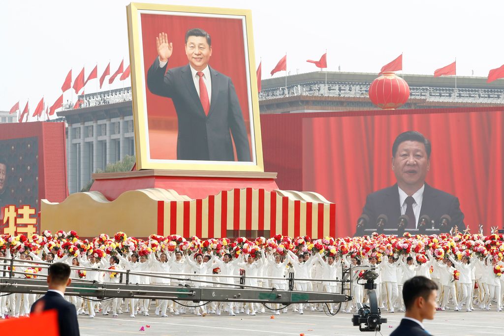 Performers travel past Tiananmen Square with a float showing Chinese President Xi Jinping during the parade marking the 70th founding anniversary of People's Republic of China, on its National Day in Beijing, China October 1, 2019.  REUTERS/Thomas Peter