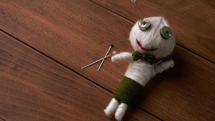 Cute Little Voodoo Doll with pins.Copy space.