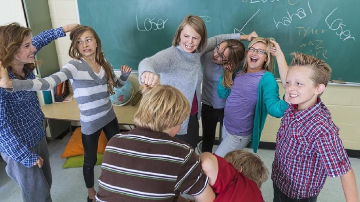 A teacher finally gives in to students misbehaving and begins to pull their hair.