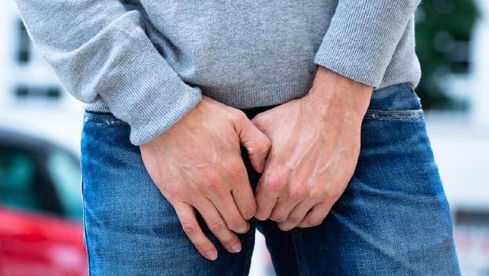 1013436466 Close-up Of A Mans Hand On His Crotch