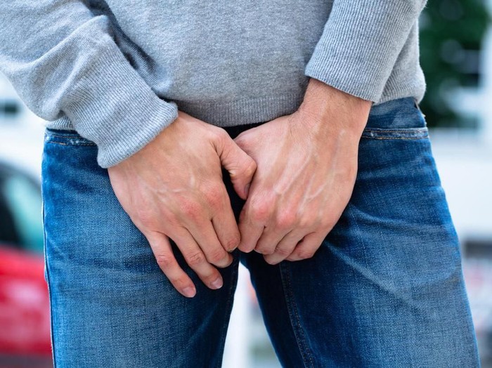 1013436466 Close-up Of A Mans Hand On His Crotch
