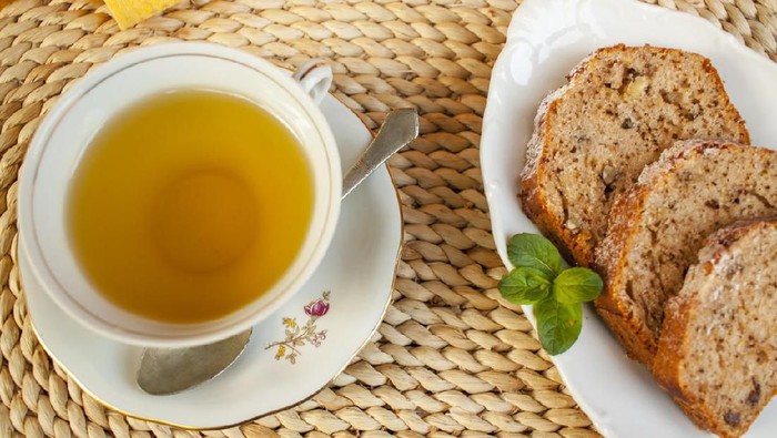 Slice of banana cake and cup of tea