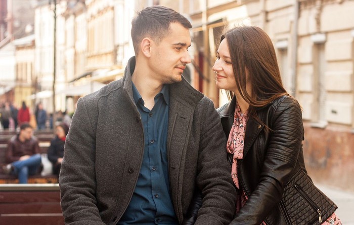 zodiak Happy couple in love outdoors looking at each other and smiling. Toned moody picture.