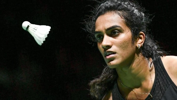 Indias Pusarla Venkata Sindhu eyes the shuttlecock during her womens singles final match against Japans Nozomi Okuhara at the BWF Badminton World Championships at the St Jakobshalle in Basel on August 25, 2019. (Photo by FABRICE COFFRINI / AFP)
