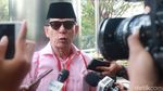 Rizal Djalil Gendong Tas Merah di KPK