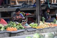 Para mama yang berjualan di pasar tradisional