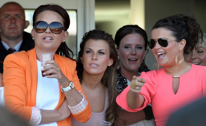 Coleen Rooney Coleen Rooney, (3rd L) wife of Manchester United and England footballer Wayne Rooney, watches the races on the second day of the Grand National meeting at Aintree Racecourse in Liverpool, north-west England on April 8, 2011. Friday is traditionally Ladies Day at the annual event which culminates in the Grand National four and a half mile steeplechase race on Saturday. AFP PHOTO/PAUL ELLIS (Photo by PAUL ELLIS / AFP)