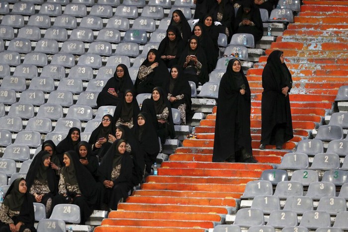 Female police officers work at the Azadi (Freedom) Stadium during a soccer match between Iran and Cambodia in the 2022 World Cup qualifier in Tehran, Iran, Thursday, Oct. 10, 2019. Iranian women were freely allowed into the stadium for the first time in decades. The decision follows the death of a young woman who set herself on fire after hearing she could face prison time for sneaking into an Iranian soccer match disguised as a man. (AP Photo/Vahid Salemi)