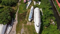 Pesawat yang telah tidak terpakai ini kerap disebut sebagai kuburan pesawat. Setelah beberapa tahun terparkir, pesawat ini dijadikan wisata yang menawarkan pengalaman unik buat traveler (AFP)
