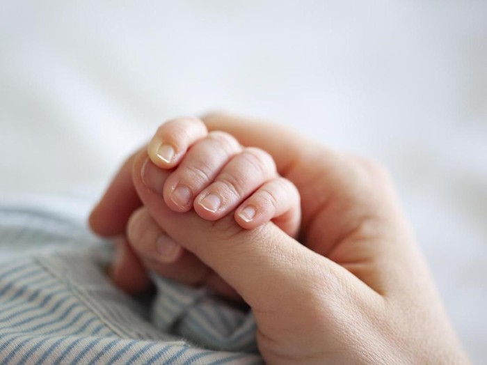Baby Boy Holding Mothers Hand