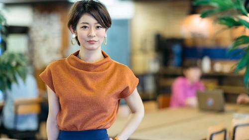 Couple of young people drinking coffee and eating cake in a stylish modern cafeteria