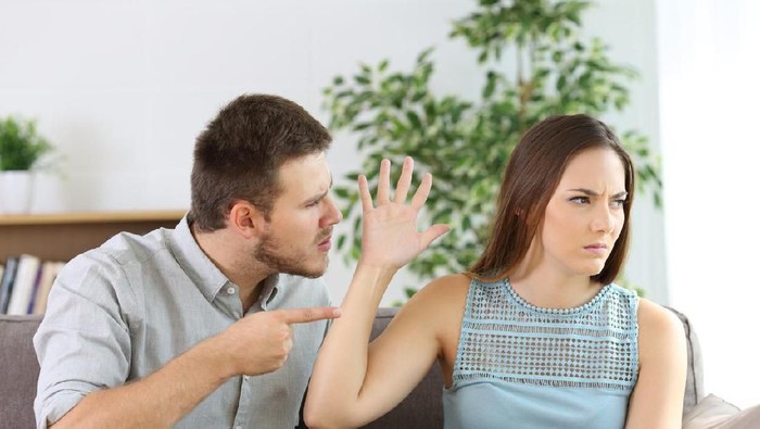 One loving boyfriend trying to comfort girlfriend embracing her