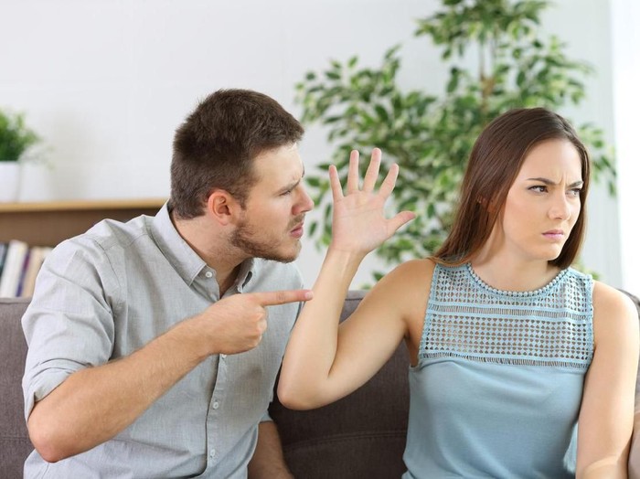 One loving boyfriend trying to comfort girlfriend embracing her