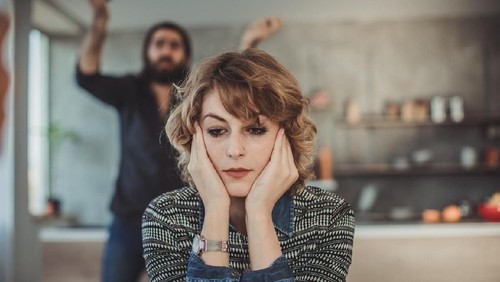 Furious couple arguing in the kitchen