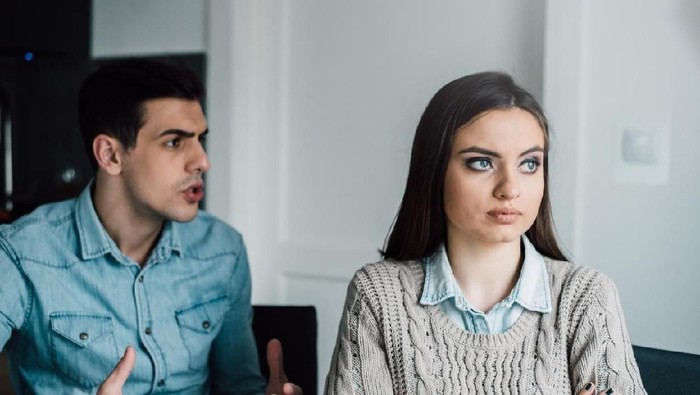 Furious couple arguing in the kitchen