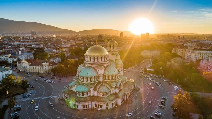 Aerial view of Alexander Nevski cathedral in Sofia, Bulgaria with setting sun. The scene is situated in downtown district of Sofia, Bulgaria (Eastern Europe) during sunset. The picture is taken with DJI Phantom 4 Pro drone.