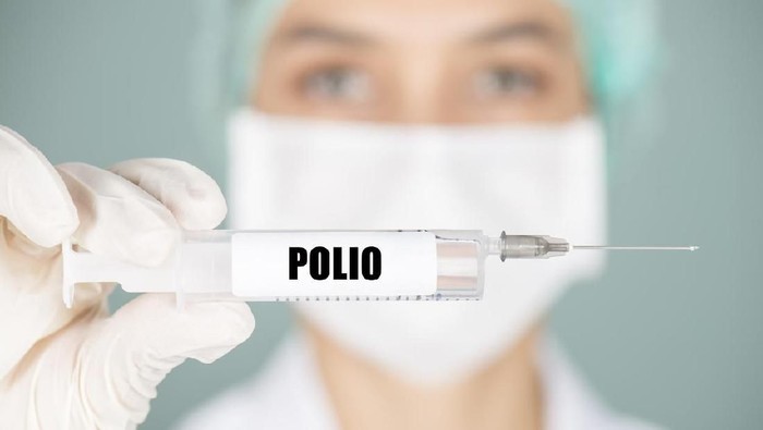 polio Female nurse or doctor holding polio vaccination.