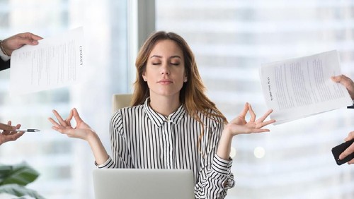 Young woman preparing home budget, using laptop and calculator