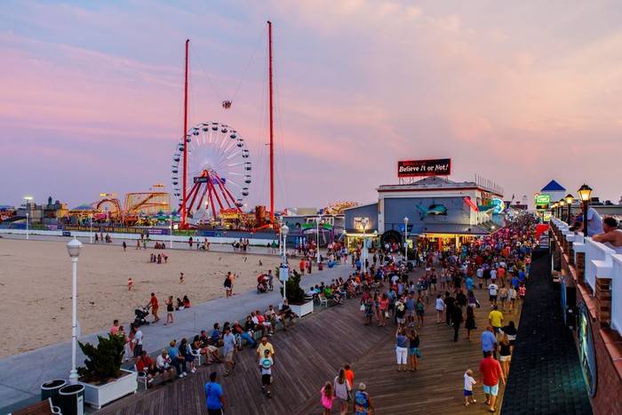 Ocean City, USA - August 4, 2014: Crowded boardwalk in Ocean City, MD on August 4, 2014. National Geographic named it one of the top 10 boardwalks in USA and The Travel Channel called it Americas best.