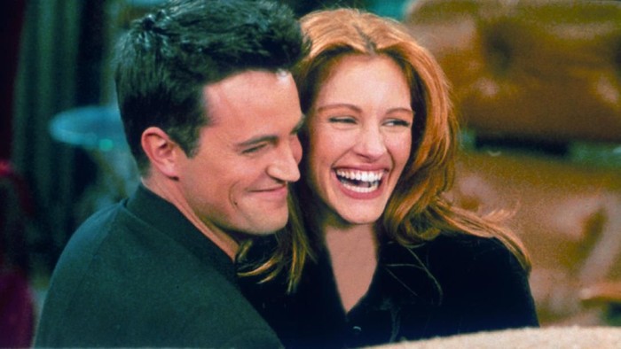 304422 21: Actor Matthew Perry and actress Julia Roberts hug each other on the set of 
