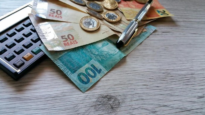 Money from Brazil. Notes of Real, Brazilian currency. Calculator.Concept of economy