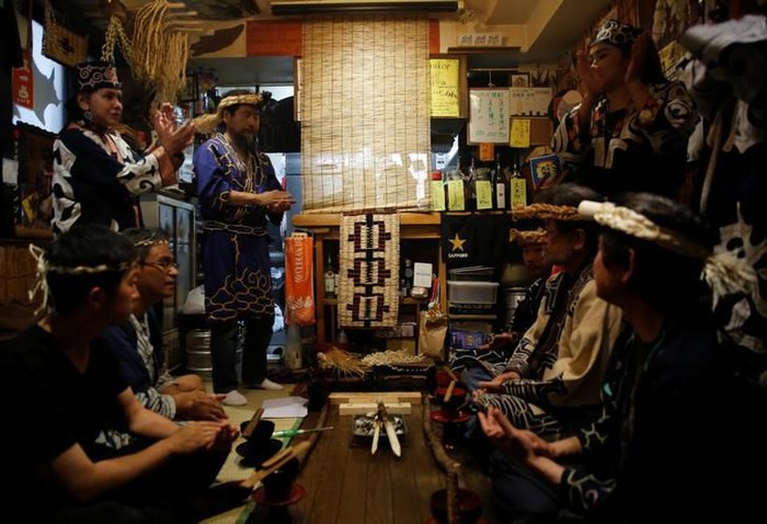 Indigenous Ainu Teruyo Usa (R) attends a traditional ritual ceremony to mark the eighth anniversary of the opening of her Ainu restaurant in Tokyo, Japan, June 6, 2019. Scholars say the Ainu settled in Japans northernmost island and across Sakhalin, Russia, by the 1300s. They hunted, fished, practiced an animist religion and spoke a language unrelated to any other. REUTERS/Kim Kyung-Hoon SEARCH KYUNG-HOON AINU FOR THIS STORY. SEARCH WIDER IMAGE FOR ALL STORIES.